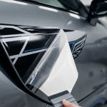 Premium Vinyl Car Decal Professional Application with Squeegee Tool on Silver Bodywork